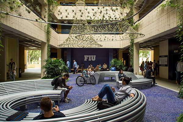 Student's gathered and sitting down in the DM plaza