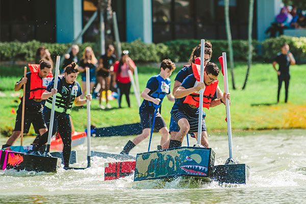 Students participating in the Walk on Water event that takes place every year behind the Green Library